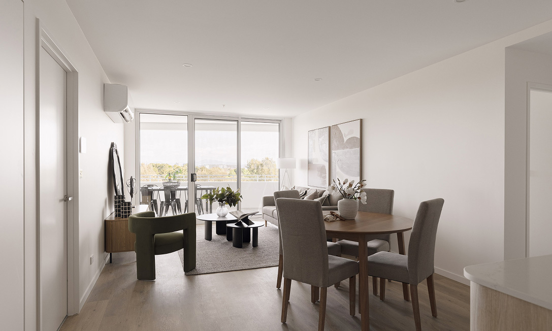 Open-plan apartment living at G+ with generous balcony and calm contemporary finishes