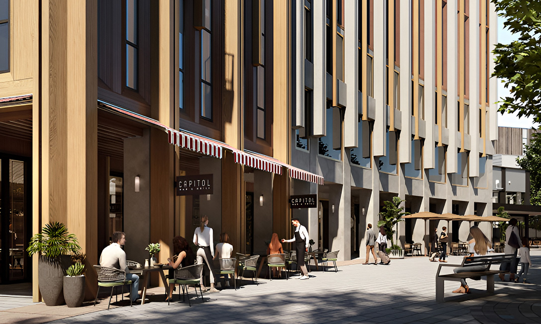 Street-level café activation beneath timber colonnade at TP Dynamics’ Garema Place Hotel, Canberra.