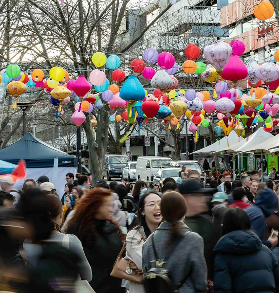 Crowd celebrating the moon festival in Canberra with colorful lanterns