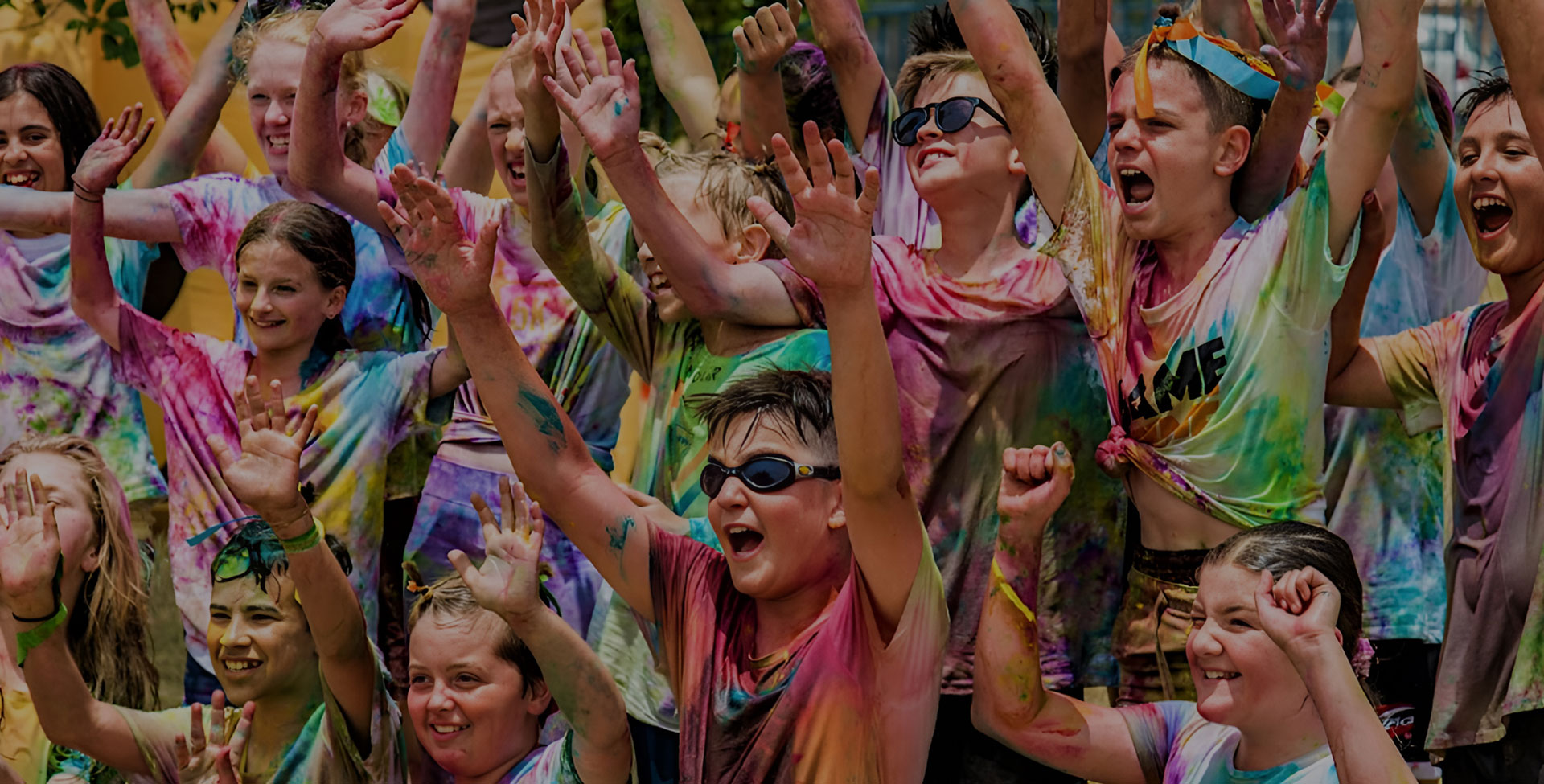Students celebrating at the Franklin Primary colour run covered in bright powder