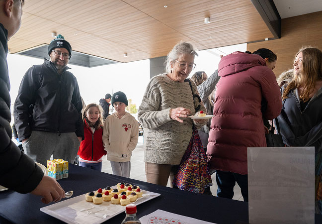 Residents gathering outside the Giralang Shops during the vibrant retail launch event