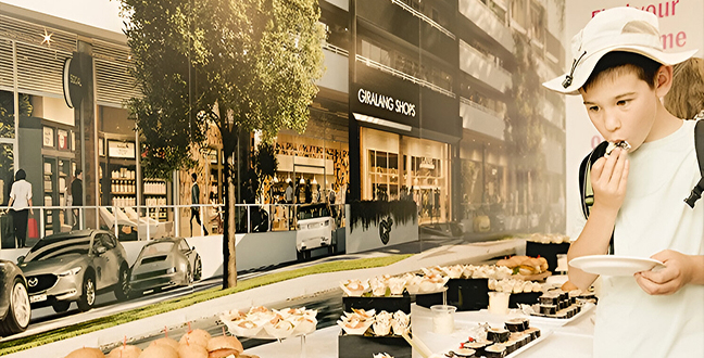 Child enjoying food at the catering table during the Giralang event