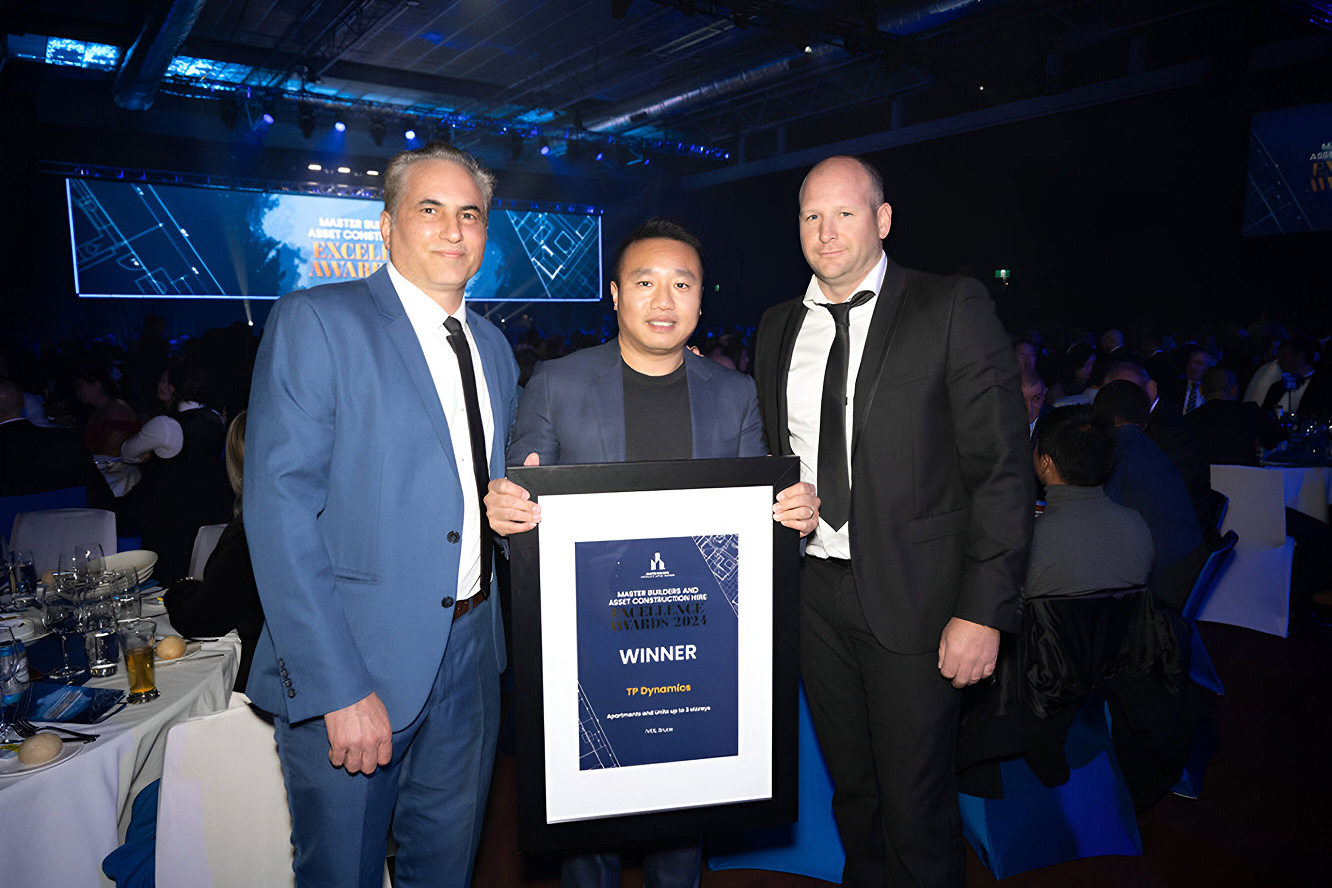 TP Dynamics team accepting MBA Excellence Award with winner certificate on stage