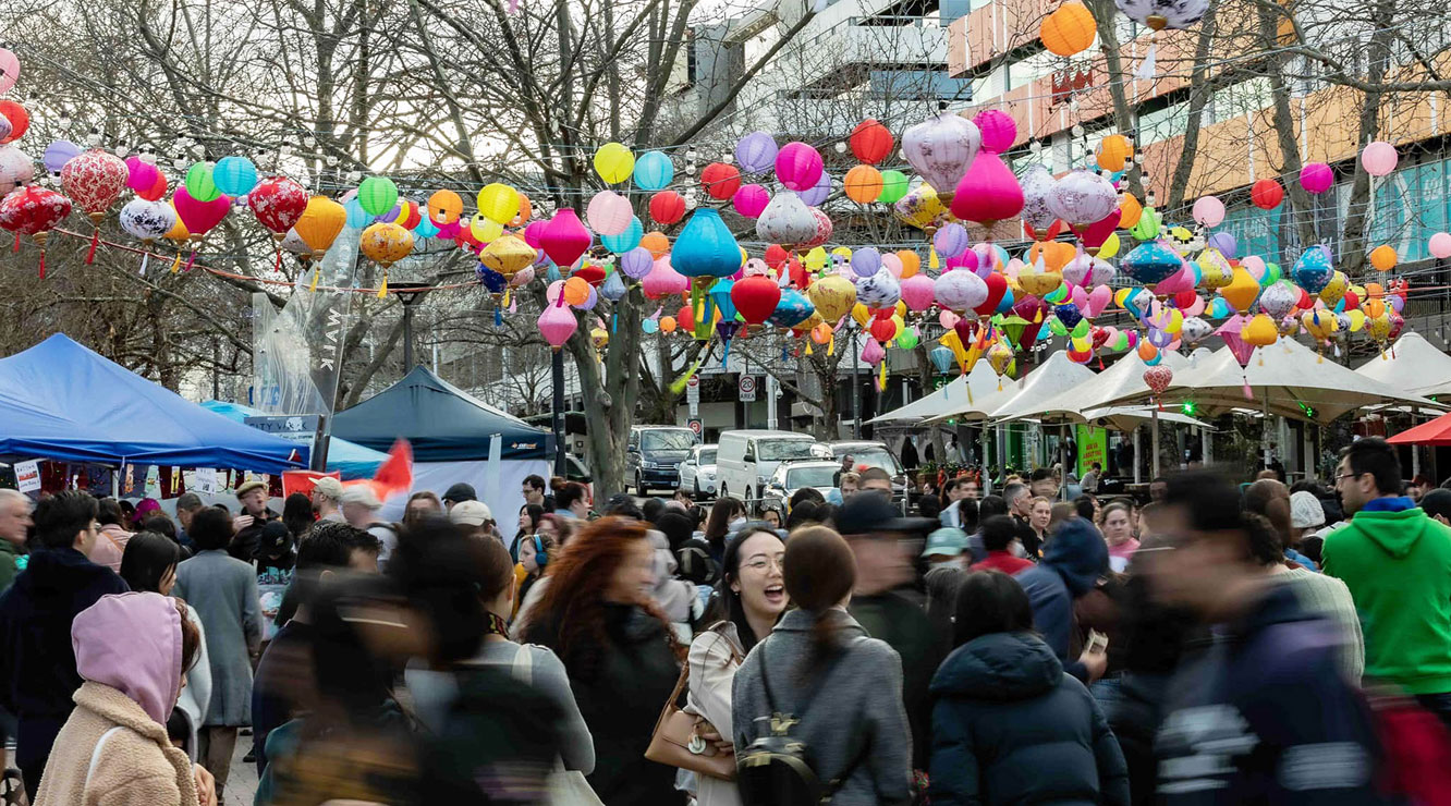 Crowd celebrating the moon festival in Canberra with colorful lanterns