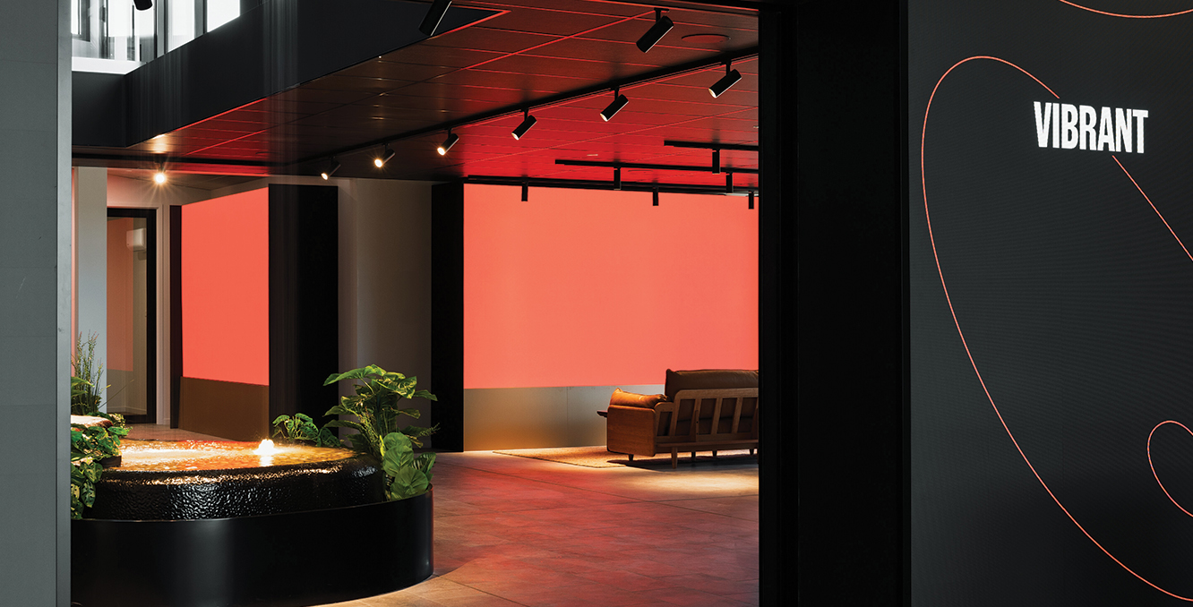 Entrance to the Newlyne Experience Centre “Vibrant” lounge with water feature and modern lighting