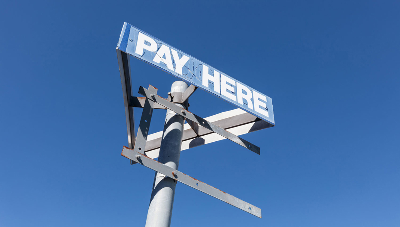 Old Pay Here sign before demolition at Dickson Village redevelopment site