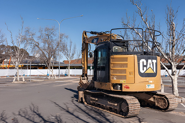 Excavator on site during early construction work at Dickson Village in Canberra