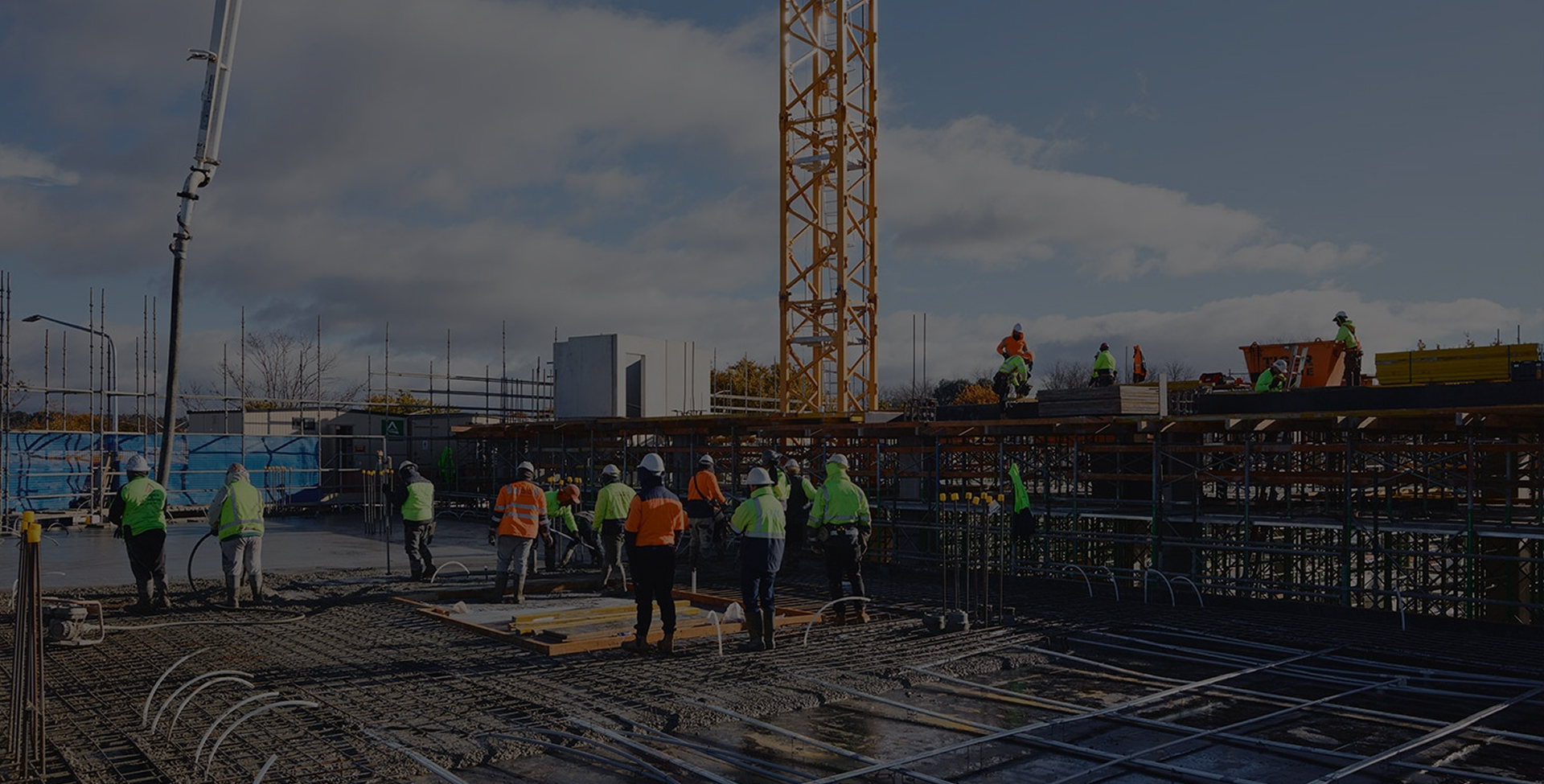 Aerial view of workers and cranes at the Dickson Village construction site