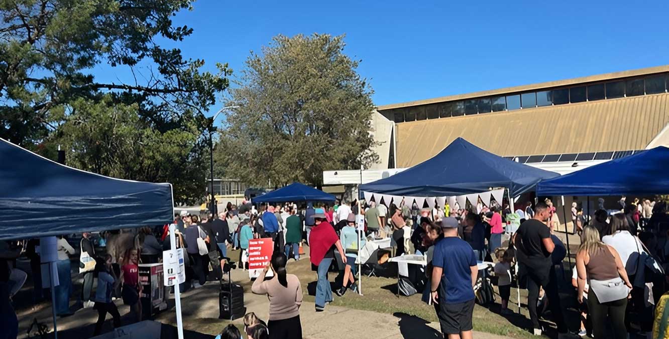 Community stalls set up at Giralang School during a local event