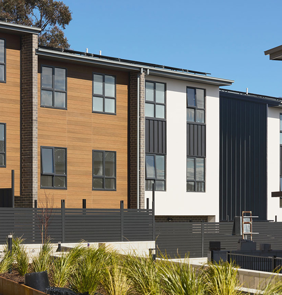 Modern townhouse exteriors at On the Rise development