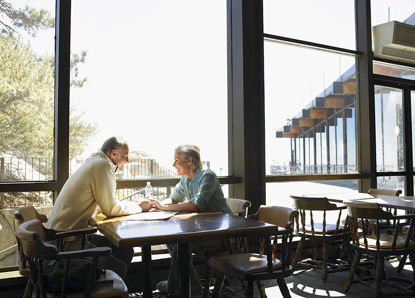 Elderly couple enjoying lifestyle at Sense of Yowani retirement village apartments in Canberra by TP Dynamics with resort-style community amenities