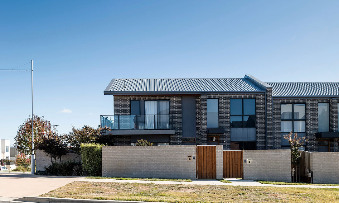 Private courtyard at Nest I with pergola and rear access extending the living space outdoors