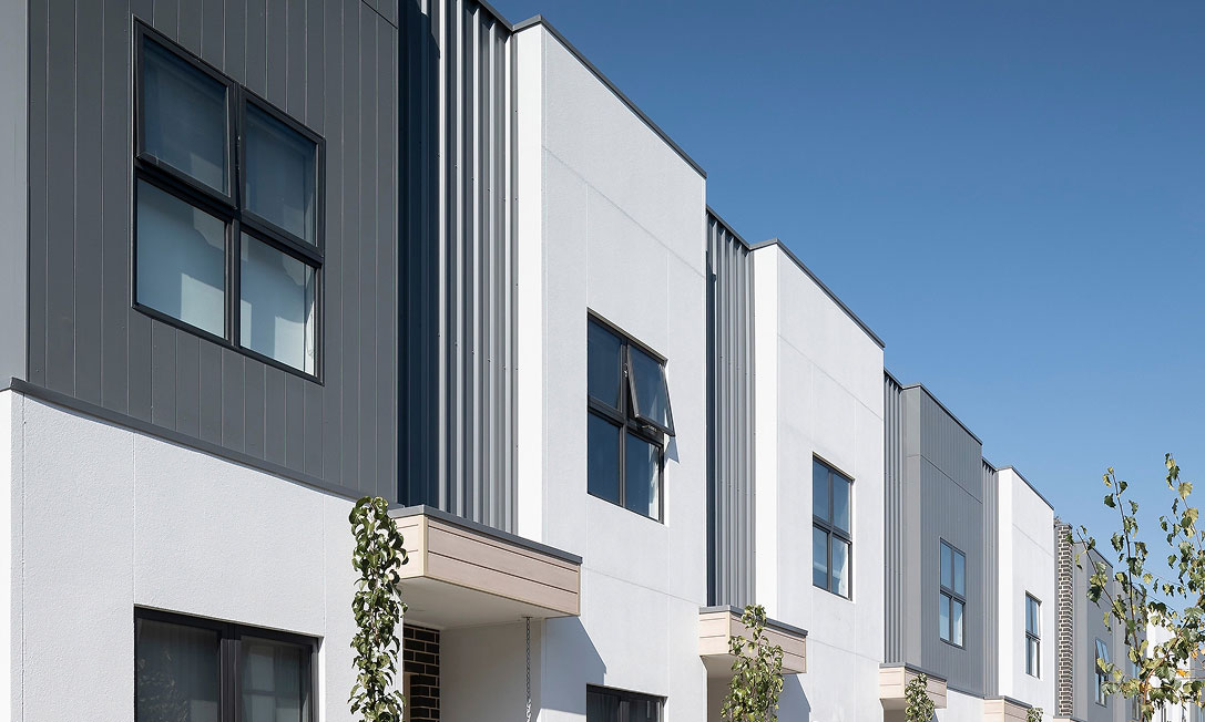 WISH townhouses in Bruce, Canberra—contemporary facade with native landscape planting