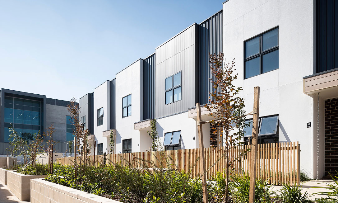 Tree-lined walkways and shared green spaces at WISH that invite connection